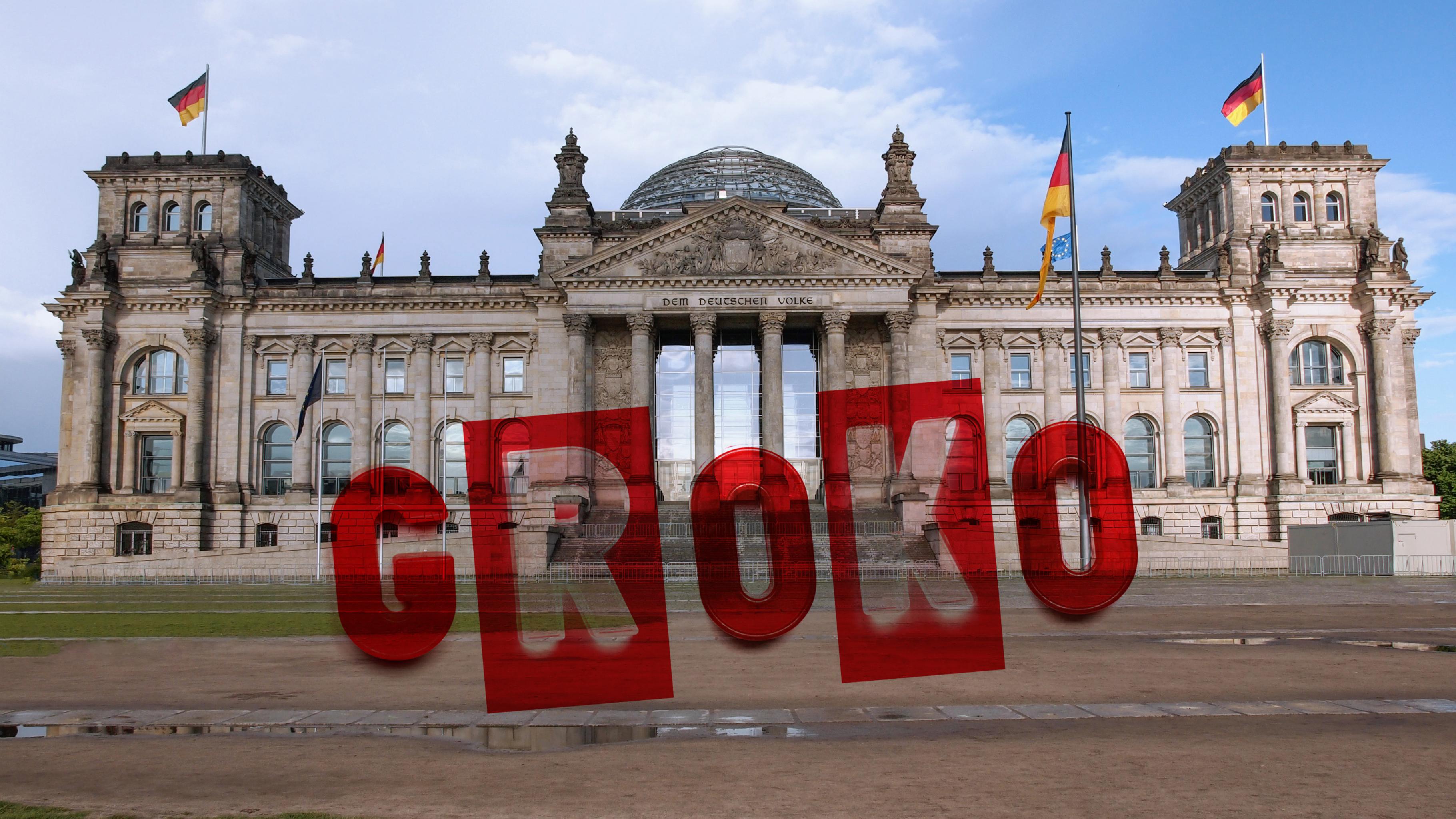 Schriftzug „GroKo“ auf einem Foto des Reichstagsgebäudes