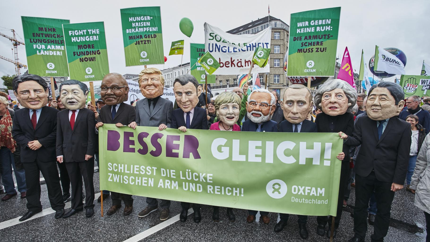 G20-Protestwelle mit Big Heads
