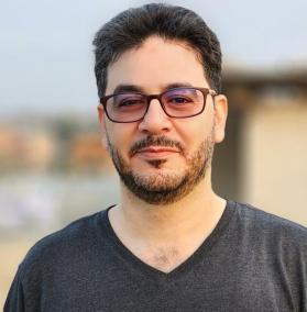 Oxfams Hilfseinsatz-Leiter Wassem Mushtaha Ein Mann schaut in die Kamera